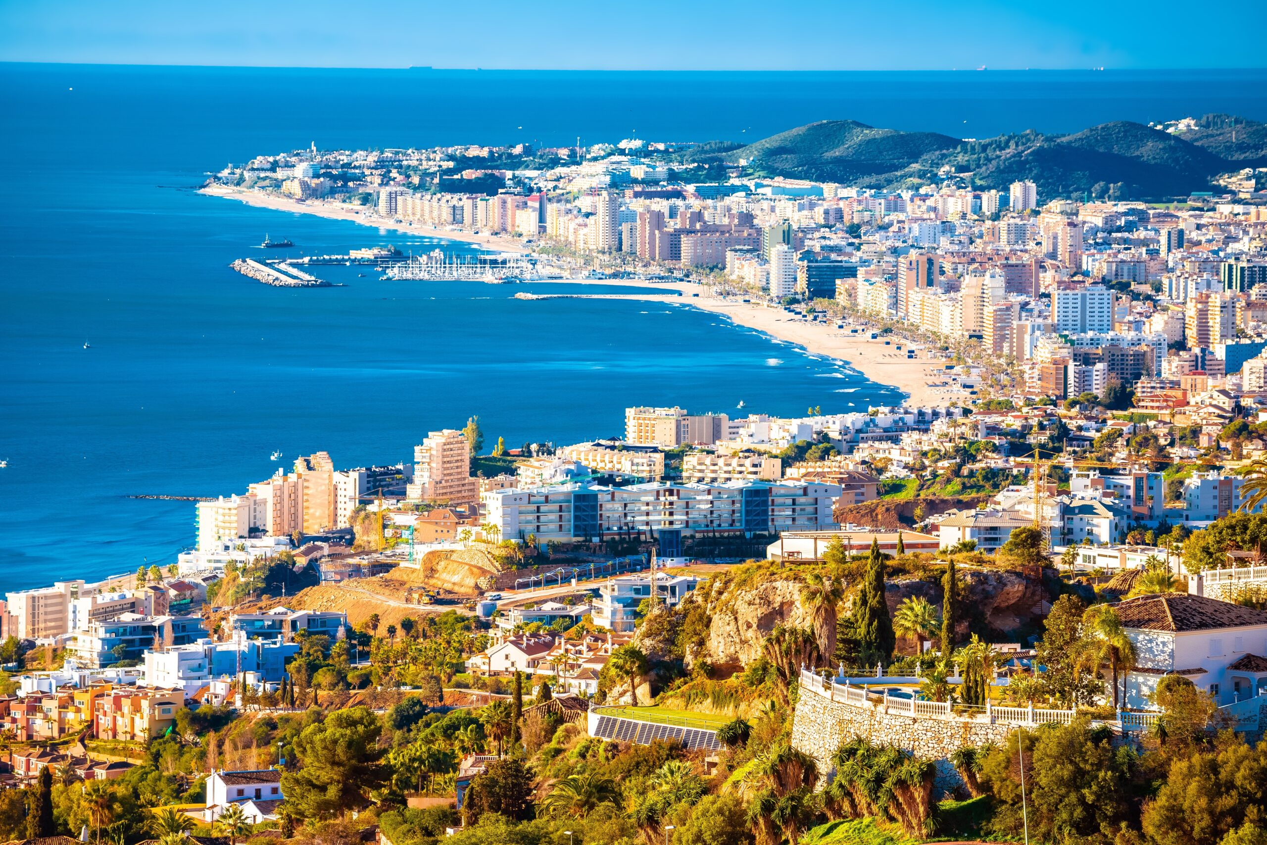 From MAlaga to Estepona A stunning view of the Costa del Sol coastline with crystal clear waters and sandy beaches.